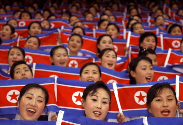 North Korean cheer team members wave their national flags during the World Students Games opening ceremony in Daegu in 2003