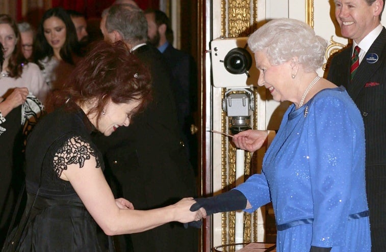 Queen Elizabeth II meets Helena Bonham Carter during the Dramatic Arts reception at Buckingham Palace on February 17, 2014 in London, England. 