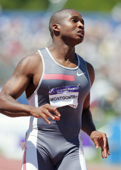 Tim Montgomery competes in the men's 100 Meter Dash Semifinals during the Olympics.