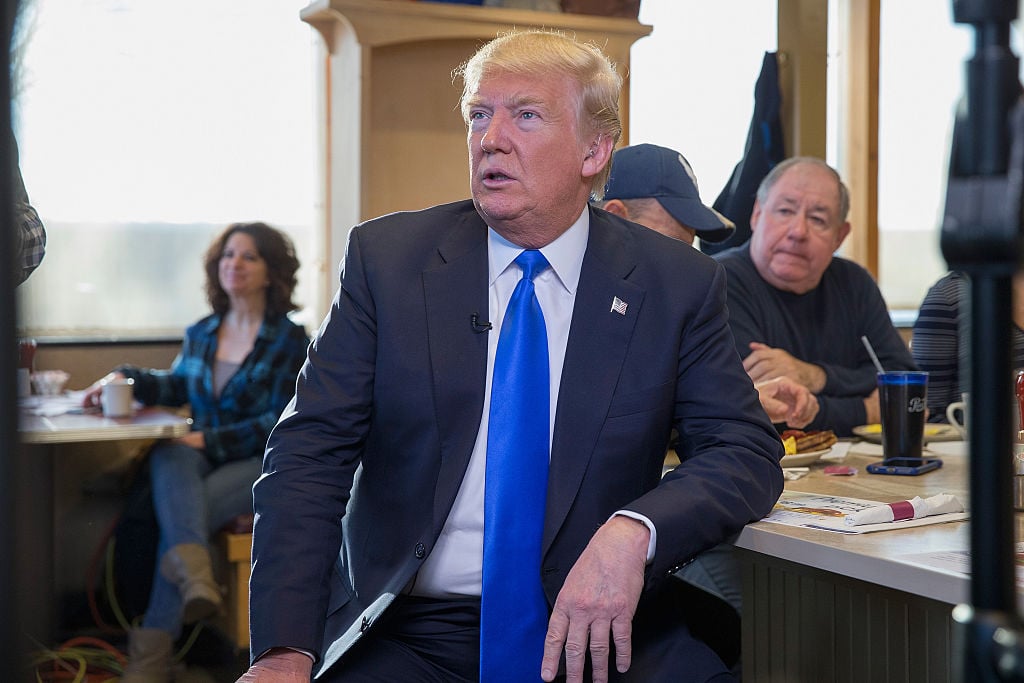 Donald Trump waits to be interviewed by Fox News at a George Webb diner on April 5, 2016 in Wauwatosa, Wisconsin. Wisconsin residents are voting in the state's primary today.
