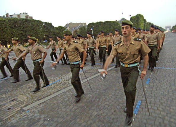 A Brazilian Army marching troop walks on the Champs-Elysees Avenue in Paris