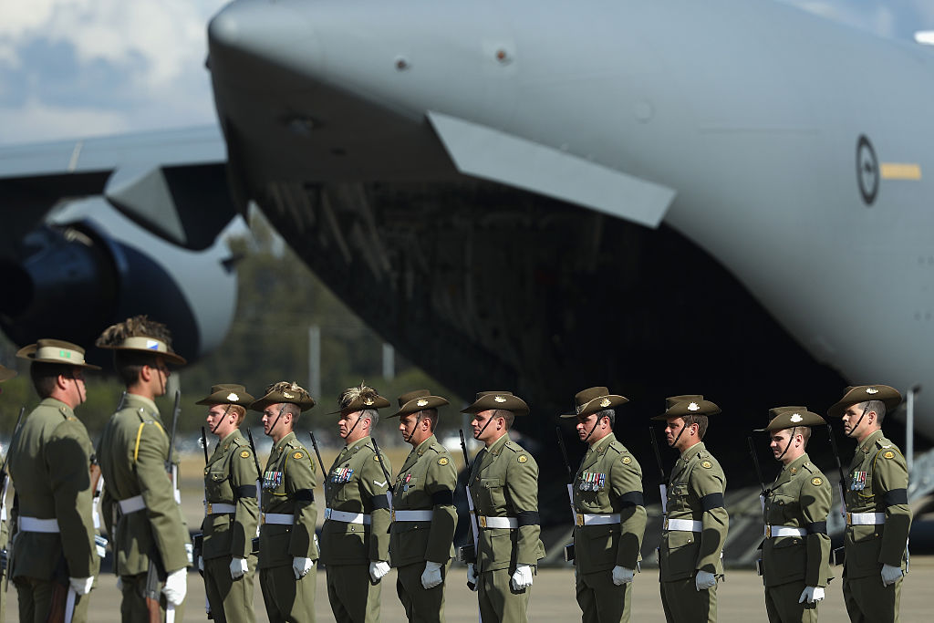 A defense force guard of honor assembles. A defense force guard of honor assembles.