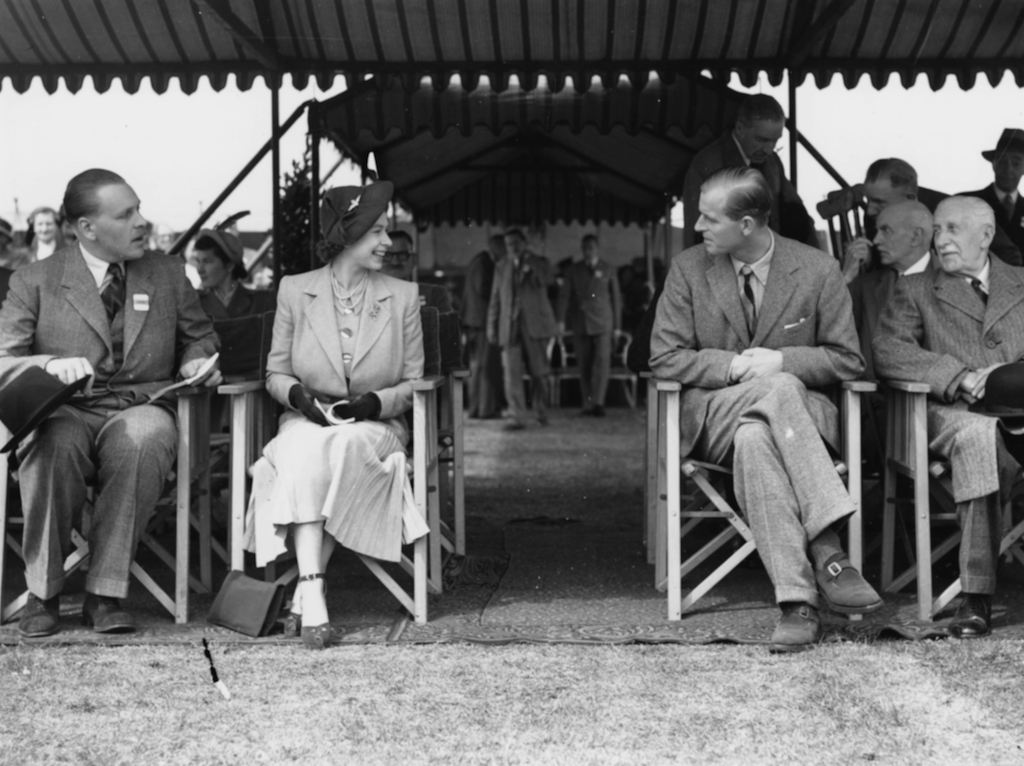 Princess Elizabeth talking to Prince Philip, the Duke of Edinburgh, at the Royal Horse Show at Windsor, England, May 12th 1949.