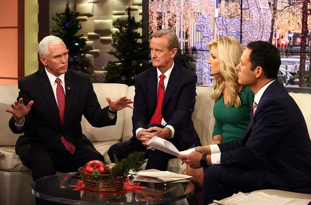 Vice President-Elect Mike Pence talks with Fox & Friends hosts, Steve Doocy, Ainsley Earhardt and Brian Kilmeade at Fox News Studios on December 6, 2016 in New York City.