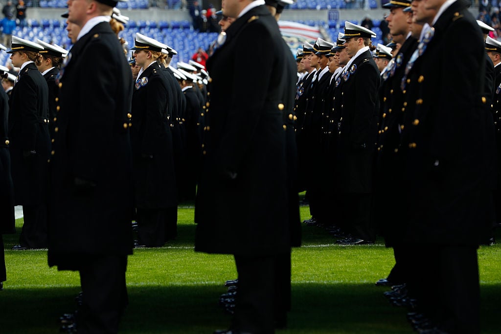 Cadets from the U.S. Naval Academy line up on field prior to the game between the Navy Midshipmen and the Army Black Nights at M&T Bank Stadium in Baltimore, Maryland. Cadets from the U.S. Naval Academy line up on field prior to the game between the Navy Midshipmen and the Army Black Nights at M&T Bank Stadium in Baltimore, Maryland.