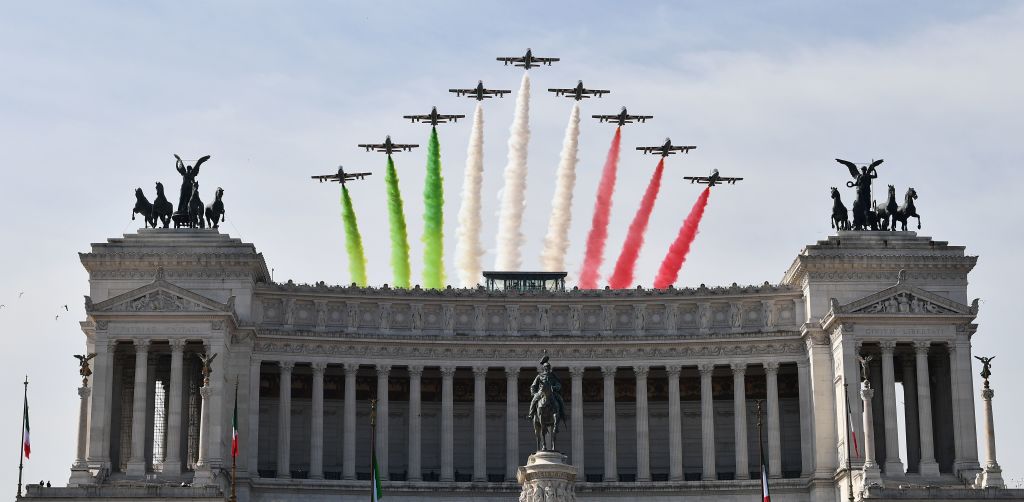 The Italian Air Force aerobatic unit Frecce Tricolori (Tricolor Arrows) spreads smoke with the colors of the Italian flag over the Vittoriano Monument. The Italian Air Force aerobatic unit Frecce Tricolori (Tricolor Arrows) spreads smoke with the colors of the Italian flag over the Vittoriano Monument.