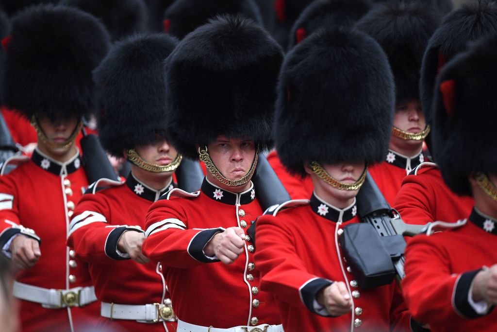 Coldstream Guards march into position outside the Houses of Parliament during the State Opening of Parliament in London. Coldstream Guards march into position outside the Houses of Parliament during the State Opening of Parliament in London.
