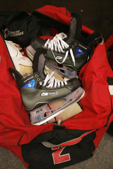 RALEIGH, NC - FEBRUARY 27: Ice skates are shown on top of a duffle bag in the Carolina Hurricanes locker room following the game against the Ottawa Senators on February 27, 2007 at RBC Center in Raleigh, North Carolina. The Senators won 4-2. skates inside a red duffle bag