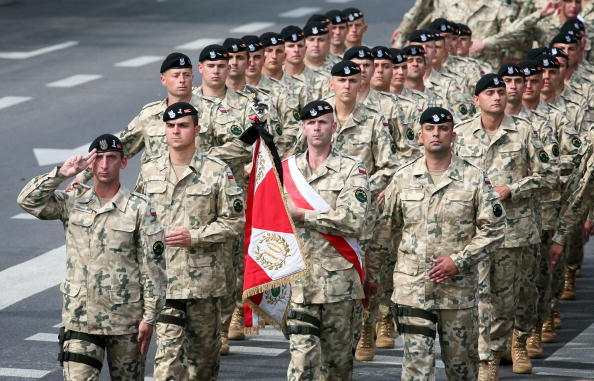 Polish soldiers march during a military parade. 