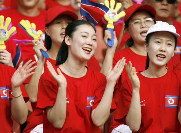 North Korean cheerleaders show their support to their team before the quarter-final match against Germany in the FIFA Women's Football World Cup in Wuhan, in 2007