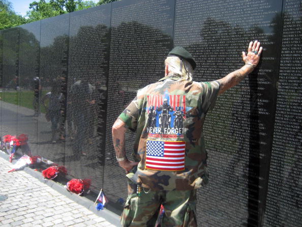 War veteran of World War II, Korea and Vietnam, Elton Ensor, 83, Navy frogman and SEAL, leans against the Vietnam Memorial Wall in Washington, DC War veteran of World War II, Korea and Vietnam, Elton Ensor, 83, Navy frogman and SEAL, leans against the Vietnam Memorial Wall in Washington, DC
