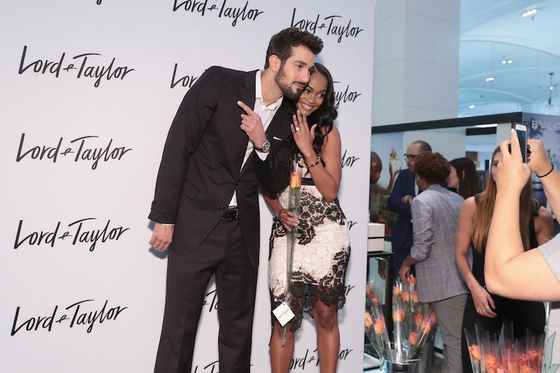 Rachel Lindsay (R) and fiancé Bryan Abasolo visit the Lord & Taylor NYC flagship store