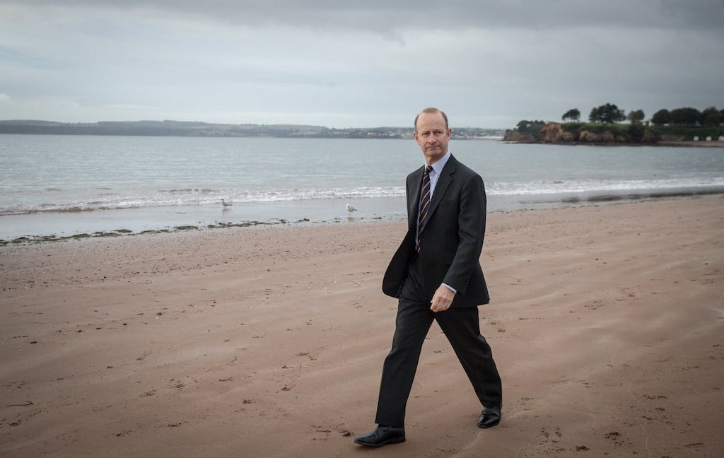 UKIP leader Henry Bolton walks on the beach following morning TV interviews at their autumn conference on September 30, 2017 in Torquay, England.