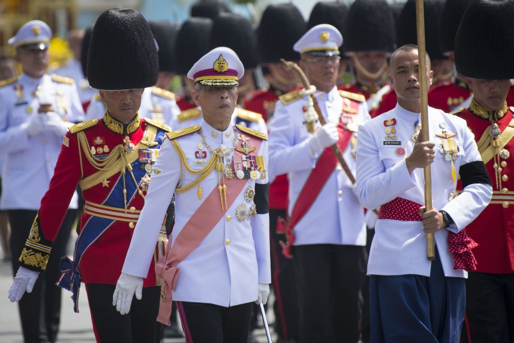 Thai king Maha Vajiralongkorn marches behind the chariots carrying the ashes of his father, the late Thai king Bhumibol Adulyadej. Thai king Maha Vajiralongkorn marches behind the chariots carrying the ashes of his father, the late Thai king Bhumibol Adulyadej.