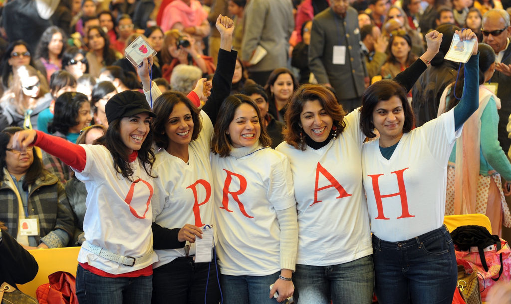 Fans of television talk show host Oprah Winfrey pose with their t-shirts during the DSC Jaipur Literature Festival women pose in oprah tshirts