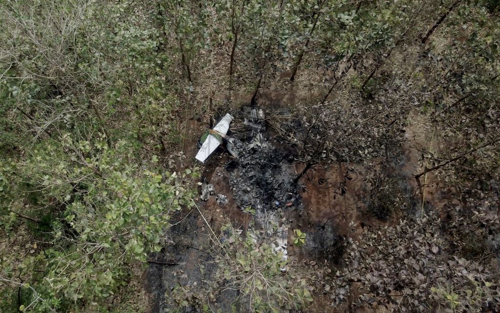 The tail of the burned fuselage of a small plane that crashed is seen near trees in Guanacaste, Corozalito, Costa Rica The tail of the burned fuselage of a small plane that crashed is seen near trees in Guanacaste, Corozalito, Costa Rica