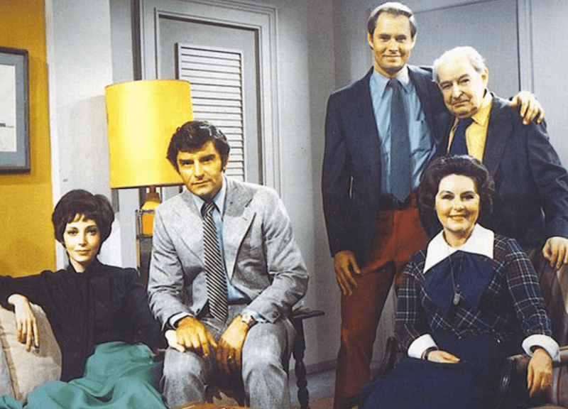 The cast of 'Guiding Light' sitting together inside an apartment. 