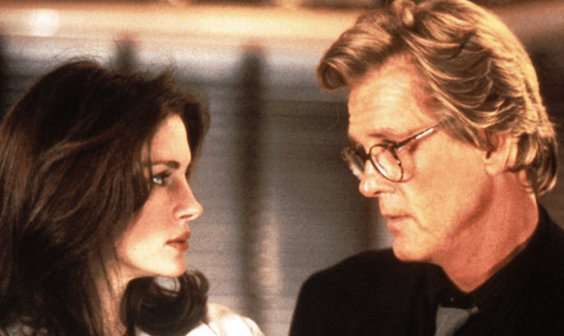 Julia Roberts and Nick Nolte look at each other as they stand closely. 
