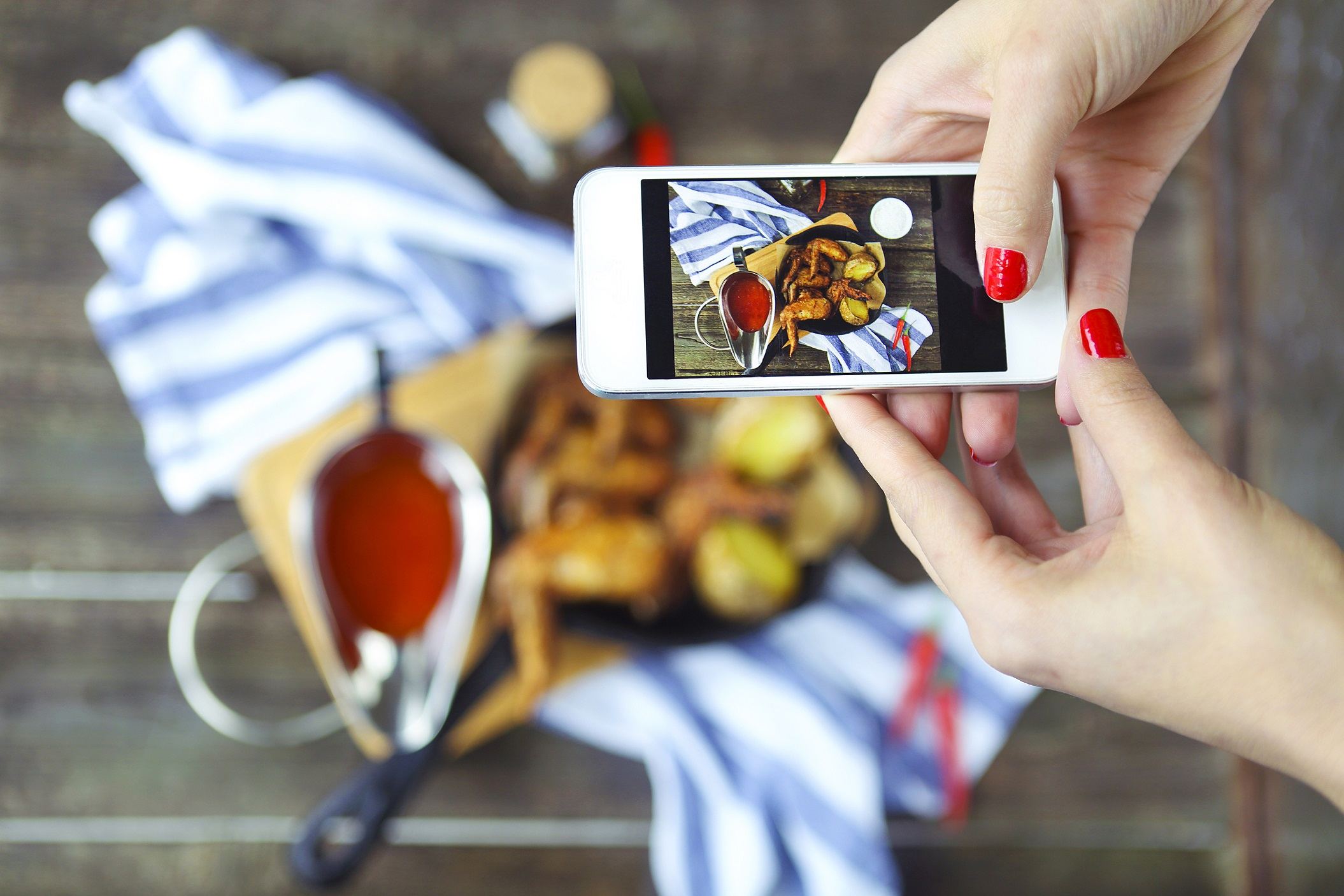 Woman taking photo of food for instagram