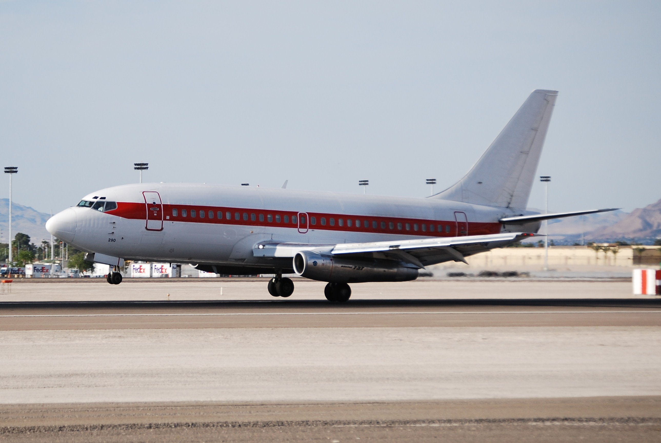 White plane with red stripe and no other markings