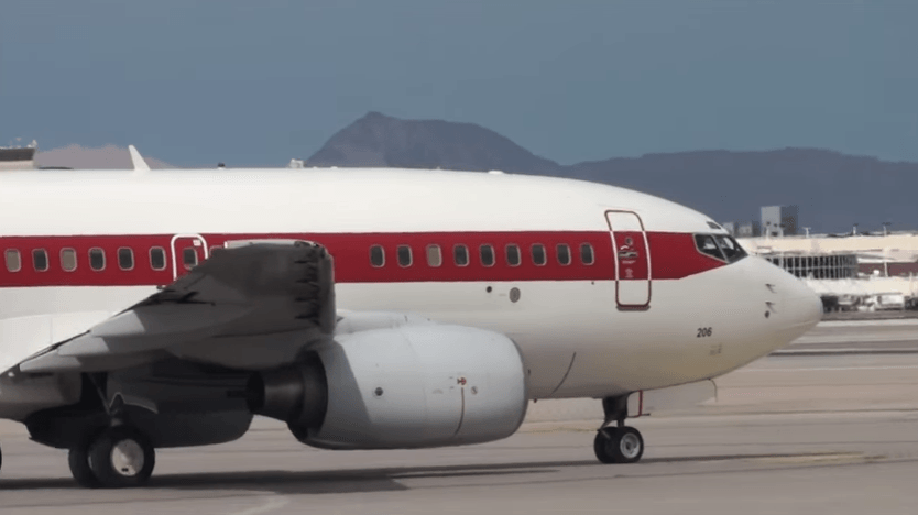 White plane with red stripe and no other markings