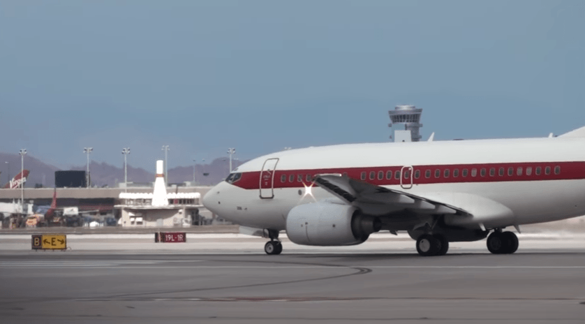 White plane with red stripe and no other markings