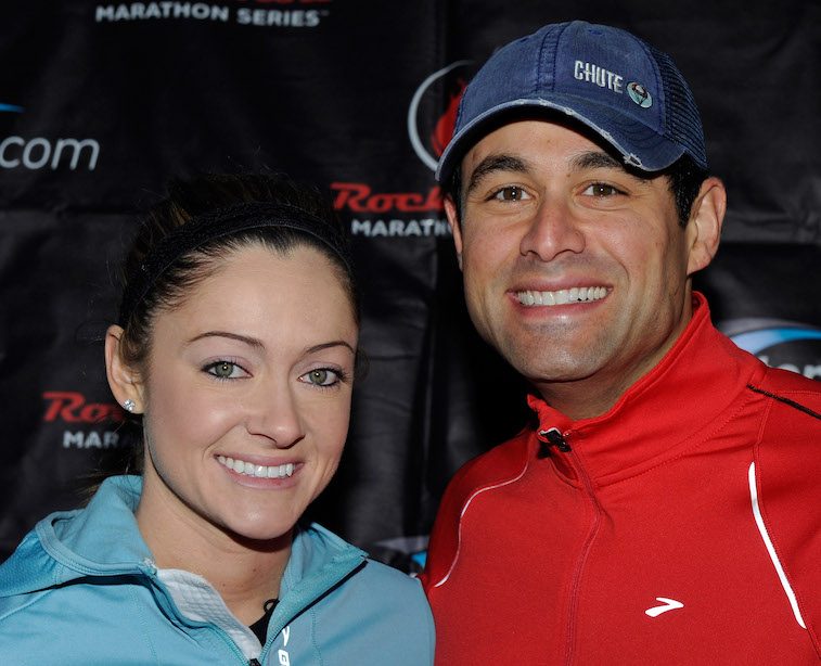 Molly and Jason smiling together at an athletic event. Molly and Jason smiling together at an athletic event.