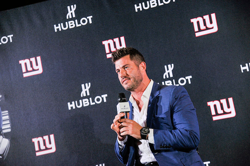 Jesse Palmer sitting and speaking into a microphone. Jesse Palmer sitting and speaking into a microphone.