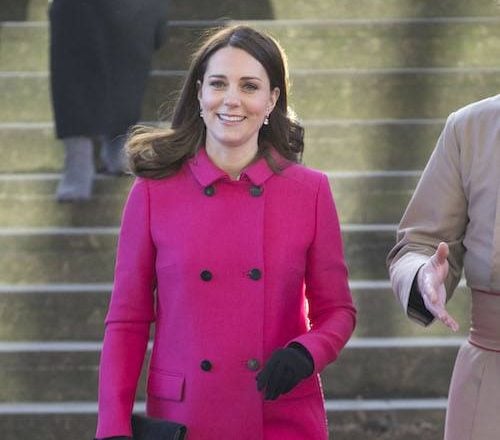 Kate Middleton walking in a pink coat. COVENTRY, ENGLAND - JANUARY 16: Catherine, Duchess of Cambridge walks around Coventry Cathedral during their visit to the city on January 16, 2018 in Coventry, England. (Photo by Heathcliff O'Malley - WPA Pool /Getty Images)