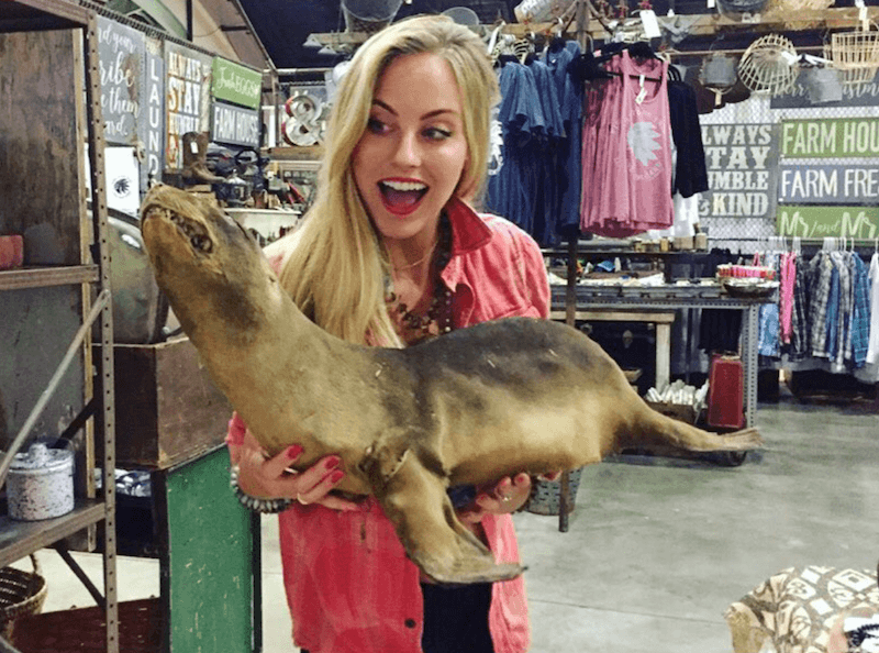 Kendall Long holding a taxidermy seal. Kendall Long holding a taxidermy seal.