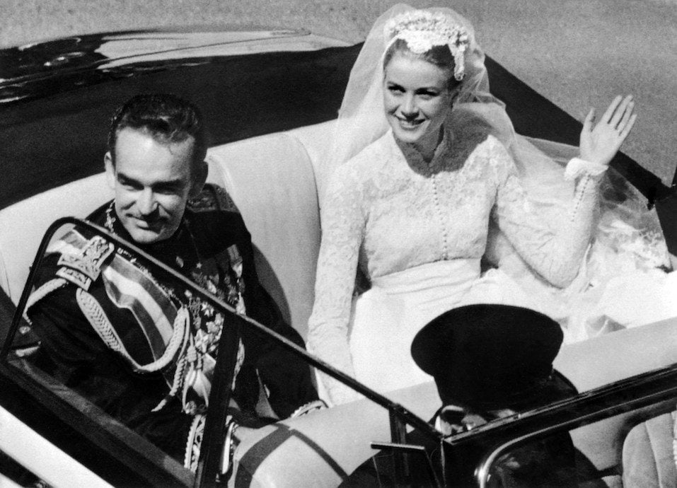 Prince Rainier III of Monaco and US actress and princess of Monaco Grace Kelly saluting the crowd Prince Rainier III of Monaco and US actress and princess of Monaco Grace Kelly saluting the crowd
