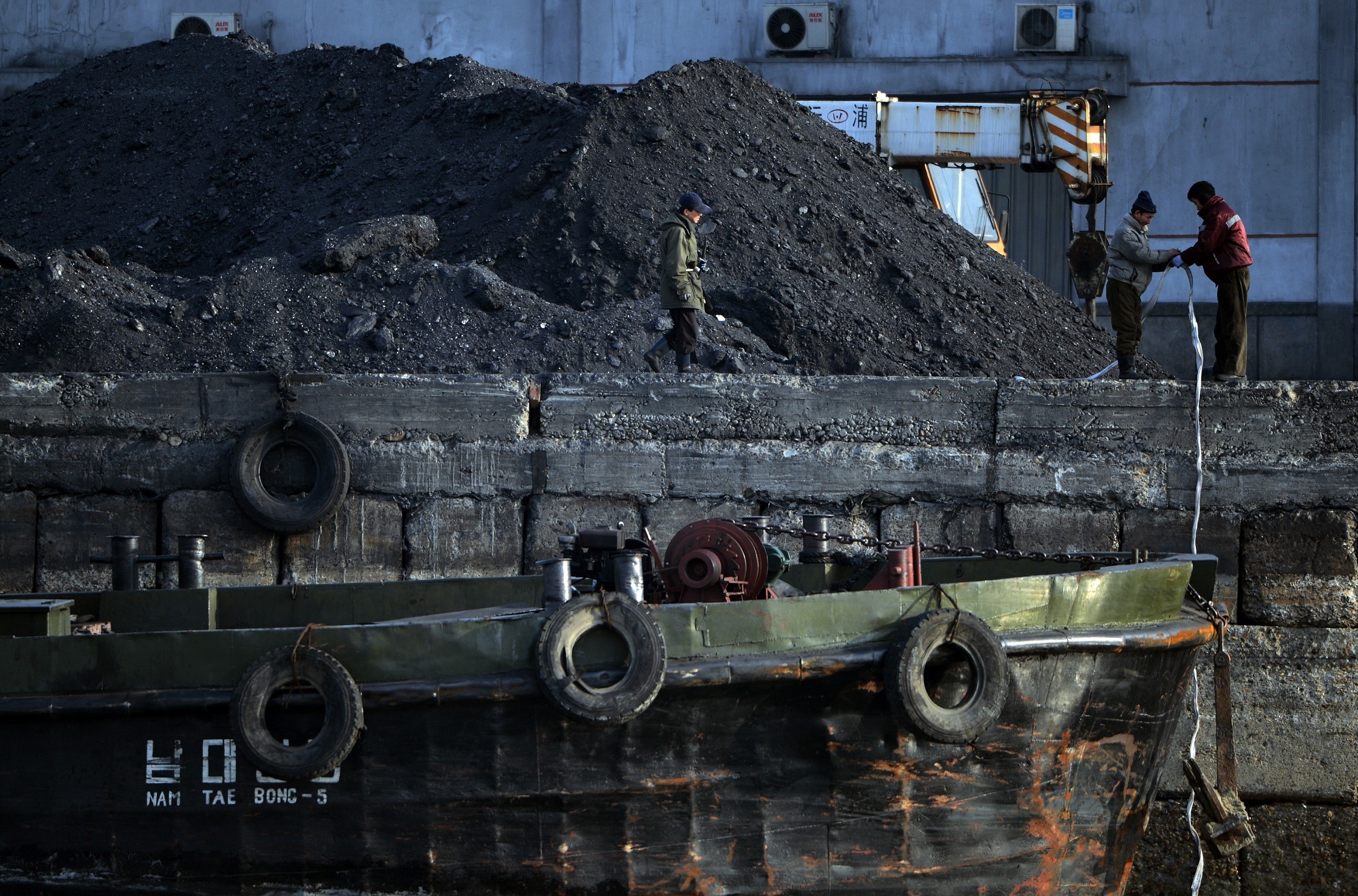 North Korean laborers near a ship North Korean laborers near a ship