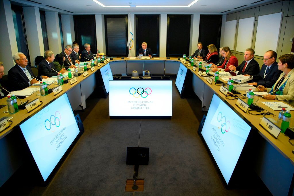 International Olympic Committee executive board members listen to president Thomas Bach from Germany