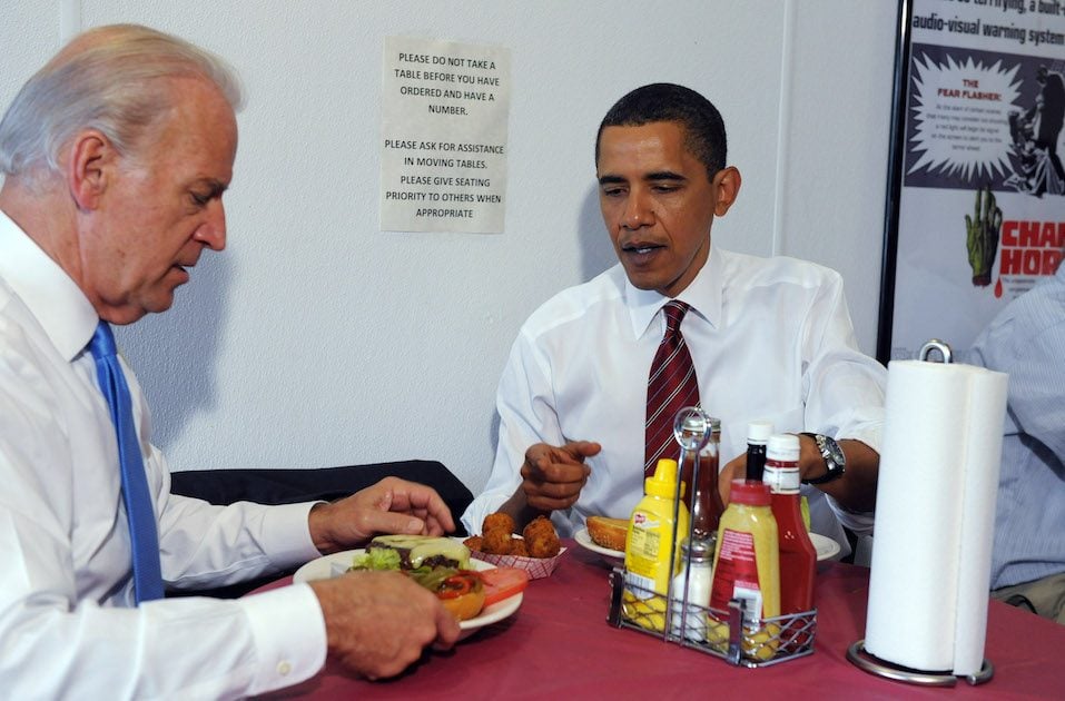 U.S. President Barack Obama and Vice President Joe Biden receive their cheeseburger lunch orders