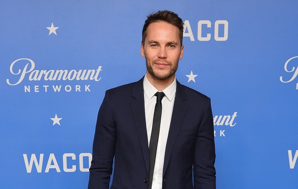 Taylor Kitsch portrays Koresh in the series. Actor Taylor Kitsch attends the world premiere of WACO