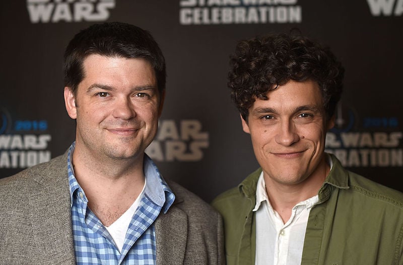Chris Miller and Phil Lord posing together on a red carpet. Chris Miller and Phil Lord posing together on a red carpet.