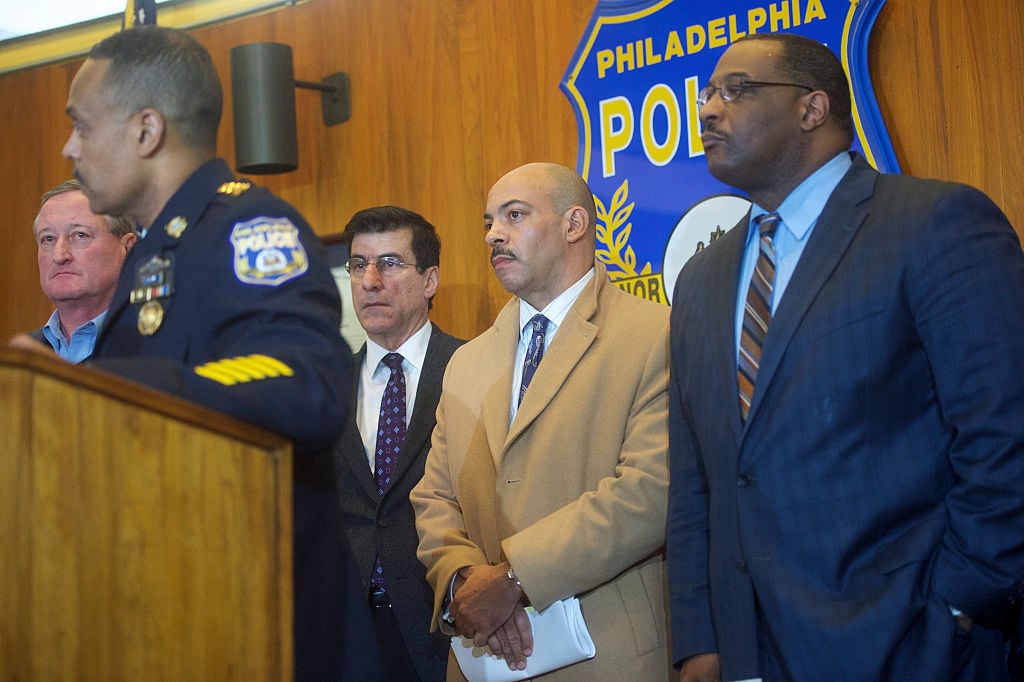 District Attorney of the city of Philadelphia Rufus Seth Williams listens to Philadelphia Police Commissioner Richard Ross