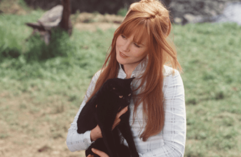 Gillian holding a black cat. Gillian holding a black cat.