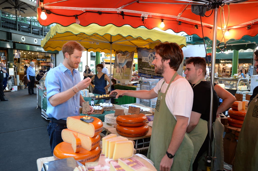 Prince Harry tours stalls during a visit to Borough Market