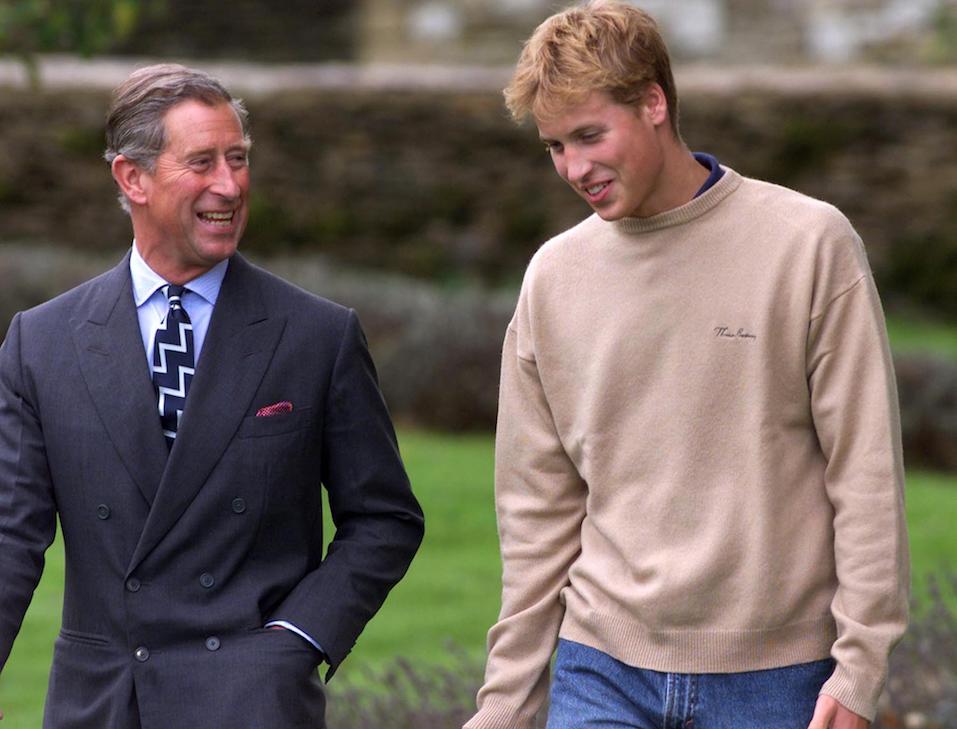 Prince William and his father Prince Charles walk through one of the gardens on the way to a photocall at Highgrove