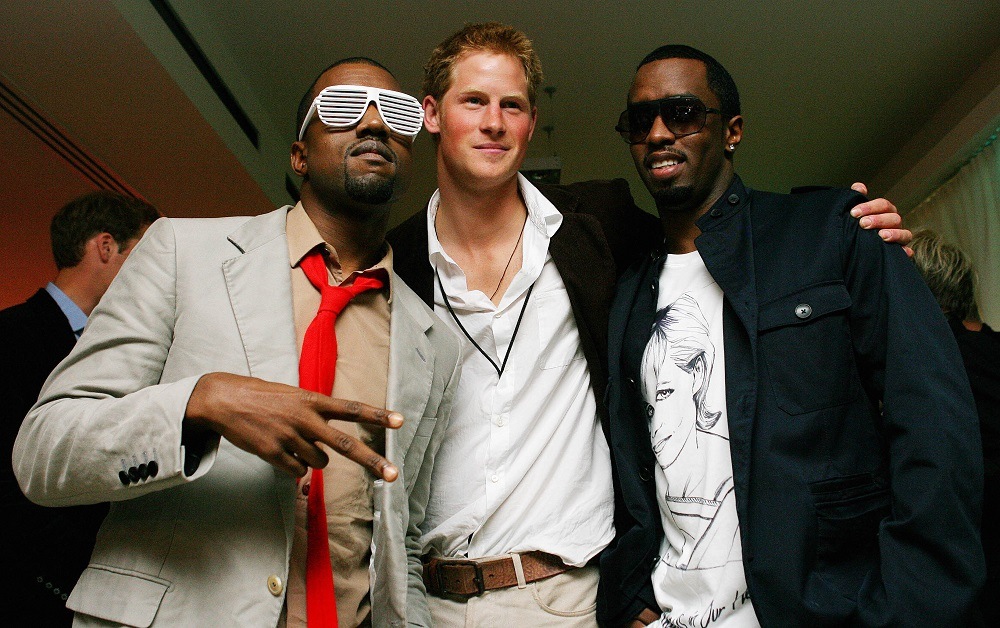 S rapper Kanye West (L) poses with Prince Harry (C) and US rapper P Diddy (R)