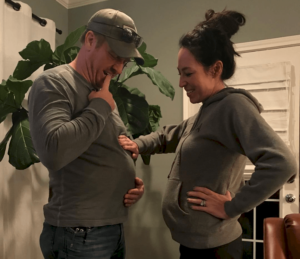 Joanna Gaines places her hand on Chip Gaines belly Joanna Gaines places her hand on Chip Gaines belly