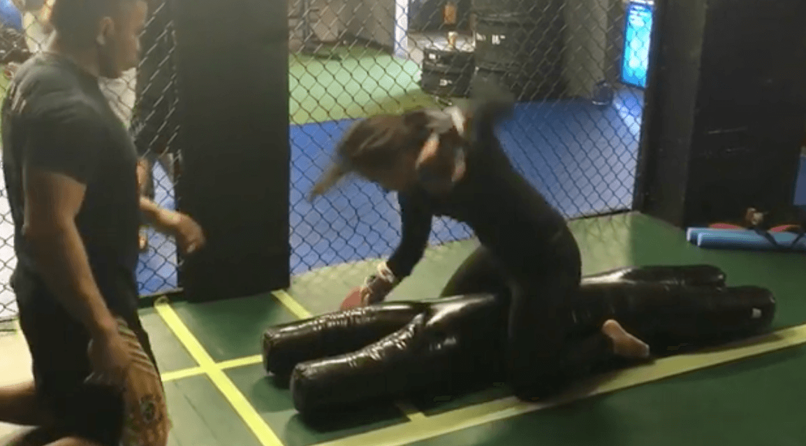 Demi Lovato training inside a martial arts studio. Demi Lovato training inside a martial arts studio.