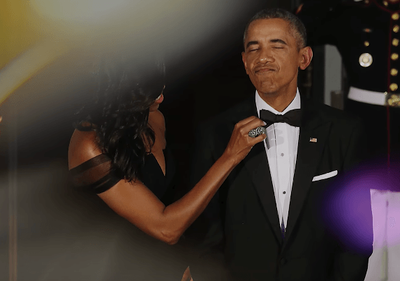 Michelle fixing Barack Obama's tie
