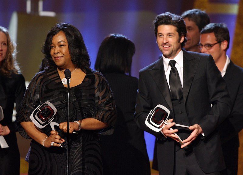 Shonda Rhimes on stage with Patrick Dempsey. 