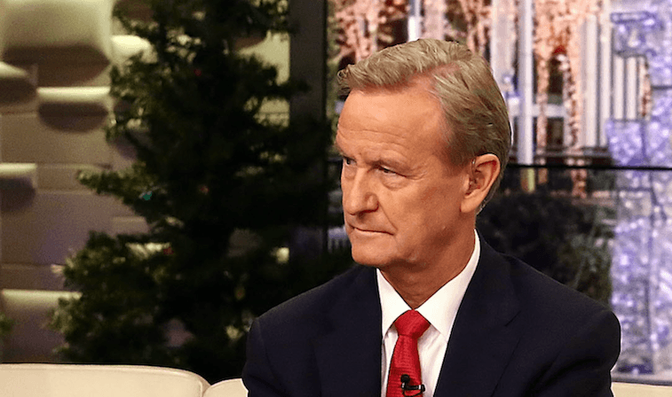 Steve Doocy wearing a black suit and red tie. Steve Doocy wearing a black suit and red tie.