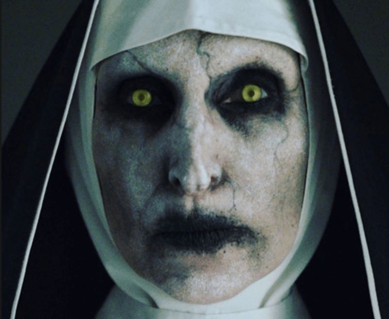 Nun with green eyes and dark makeup. Nun with green eyes and dark makeup.