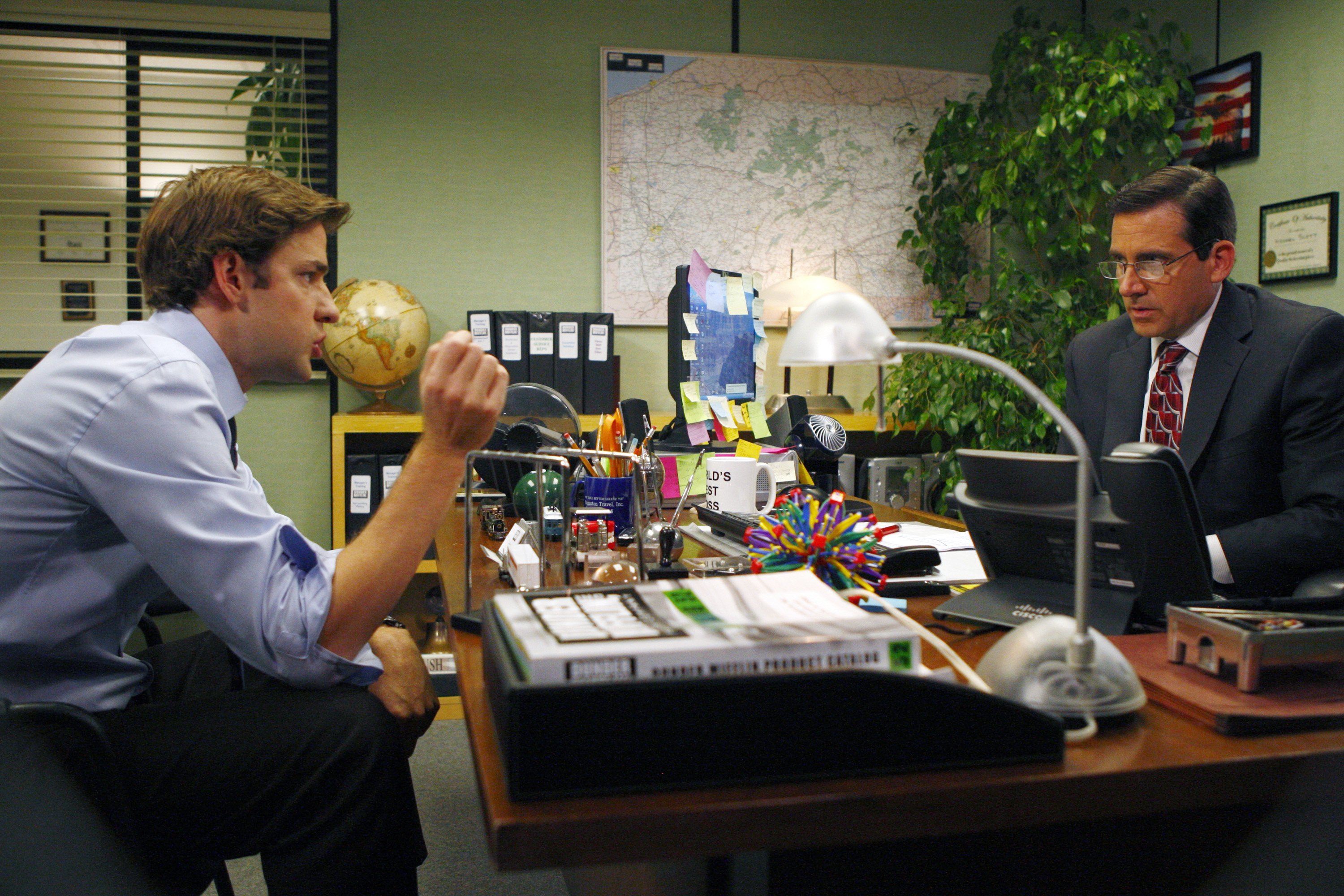Jim and Michael at a desk on The Office Jim and Michael at a desk on The Office