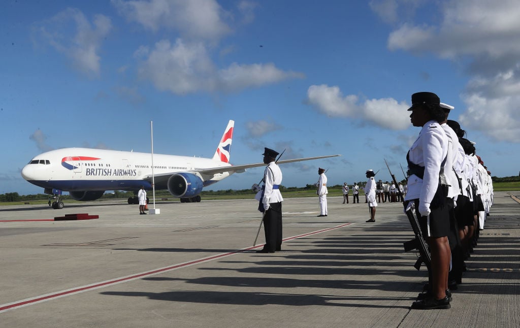 Prince Charles, Prince of Wales arrives on a British Airways flight into VC Bird International Airport