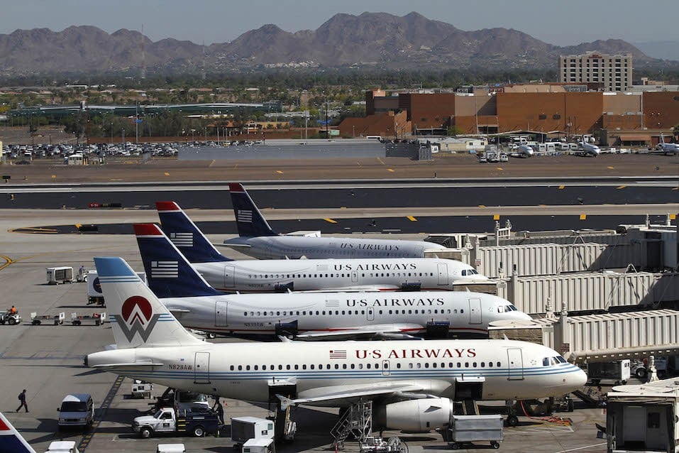 US Airways airplanes sit at terminal four gates at Sky Harbor International Airport